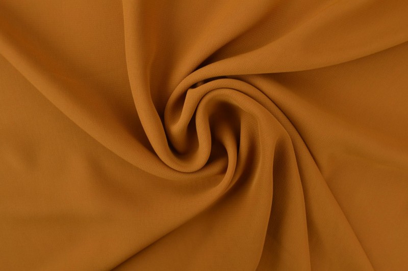 Chiffon stof donker okergeel