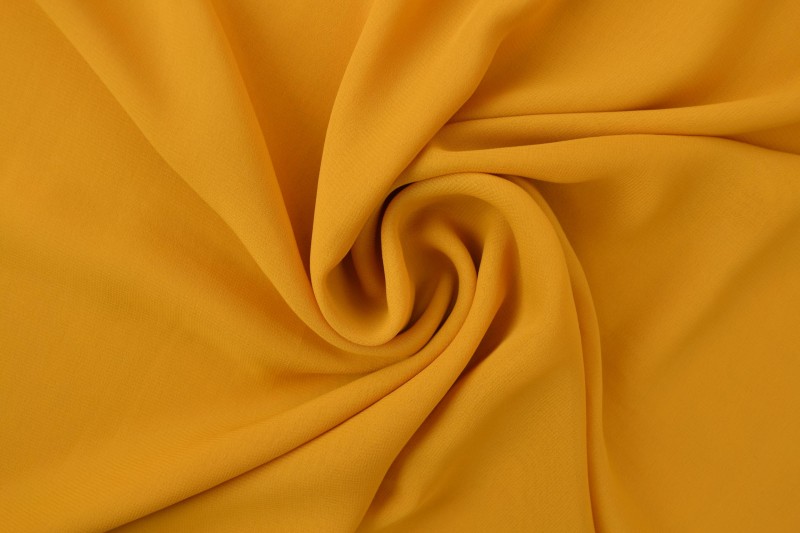 Chiffon stof okergeel